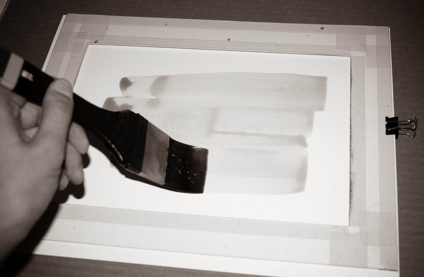 Brushing the emulsion onto the paper